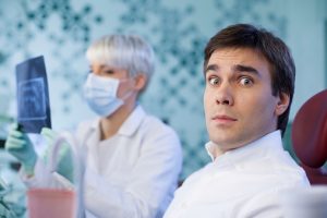 Scared man in dental office